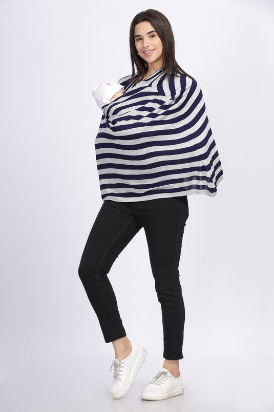 Full-length view of mother using the navy and grey stripe feeding cover on the go